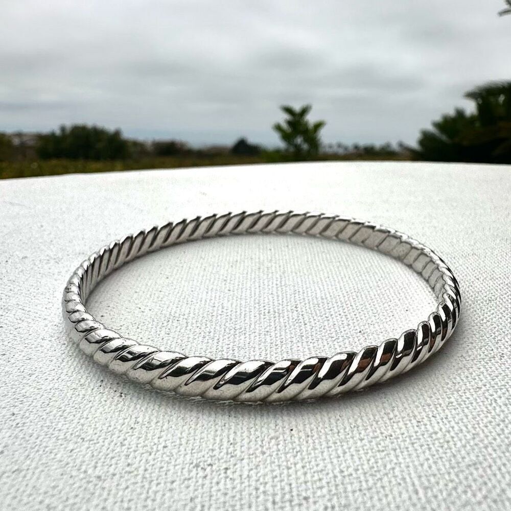 Silver tone twisted bangle bracelet